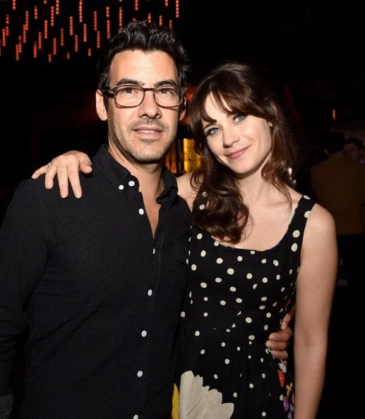 LOS ANGELES, CA - SEPTEMBER 10: Jacob Pechenik (L) and actress Zooey Deschanel pose at the after party for the premiere of Roadside Attractions' 