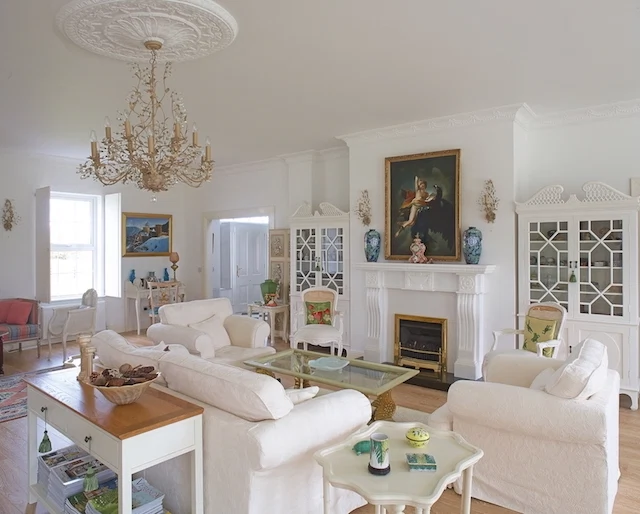 The living room has opulent touches but a distinct country feel.