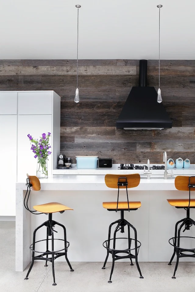 From our November-December issue; Vanessa Kilduff's bespoke kitchen in Dublin 4. Cabinets and counters are designed by Robert Mooney and the wooden walls are from Ebony and Co. Photography by Ruth Maria Murphy
