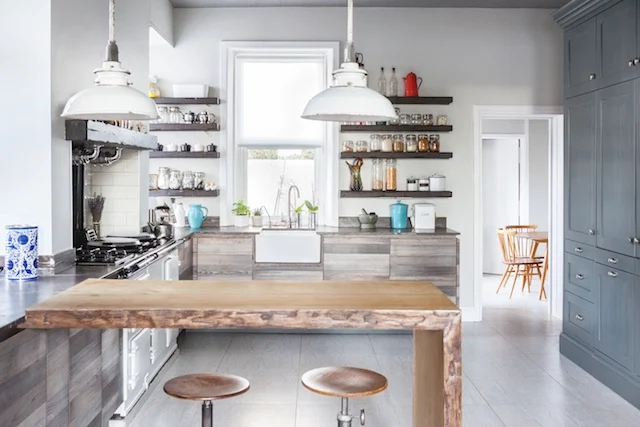 From our March-April issue; owners of two of Belfast's best-known vintage businesses - ReFound and On the Square; the kitchen cupboards are reclaimed ash with a reclaimed oak floating-shelf. Photography by Ruth Maria Murphy.