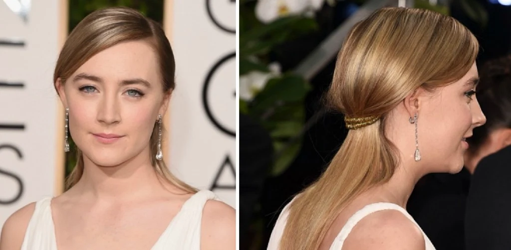 Saoirse Ronan wore two braids twisted Grecian-style with golden thread in her hair and natural make up. 