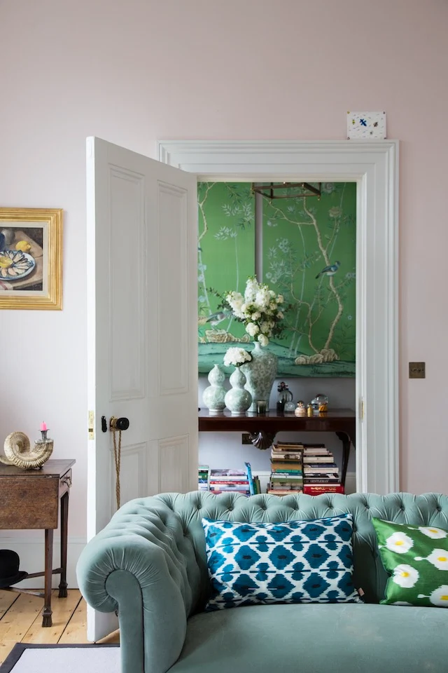 The De Gournay framed wallpaper panels bring the hallway to life.
