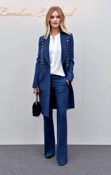 LONDON, ENGLAND - FEBRUARY 22: Rosie Huntington-Whiteley attends the Burberry show during London Fashion Week Autumn/Winter 2016/17 at Kensington Gardens on February 22, 2016 in London, England. (Photo by Anthony Harvey/Getty Images)