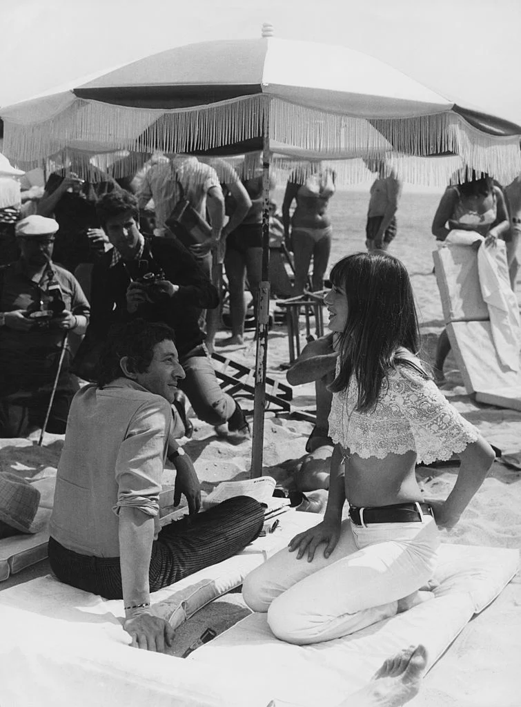 French singer-songwriter Serge Gainsbourg (1928 - 1991) with English actress Jane Birkin on the beach at Cannes, 19th May 1969. (Photo by Keystone/Hulton Archive/Getty Images)