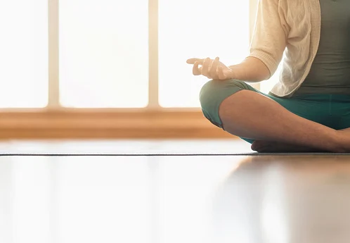 Woman meditating on floor