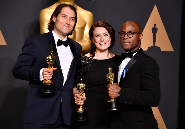 HOLLYWOOD, CA - FEBRUARY 26: (L-R) Producers Jeremy Kleiner (L) and Adele Romanski (C), winners of the award for Best Picture for 'Moonlight,' pose with filmmaker Barry Jenkins in the press room during the 89th Annual Academy Awards.