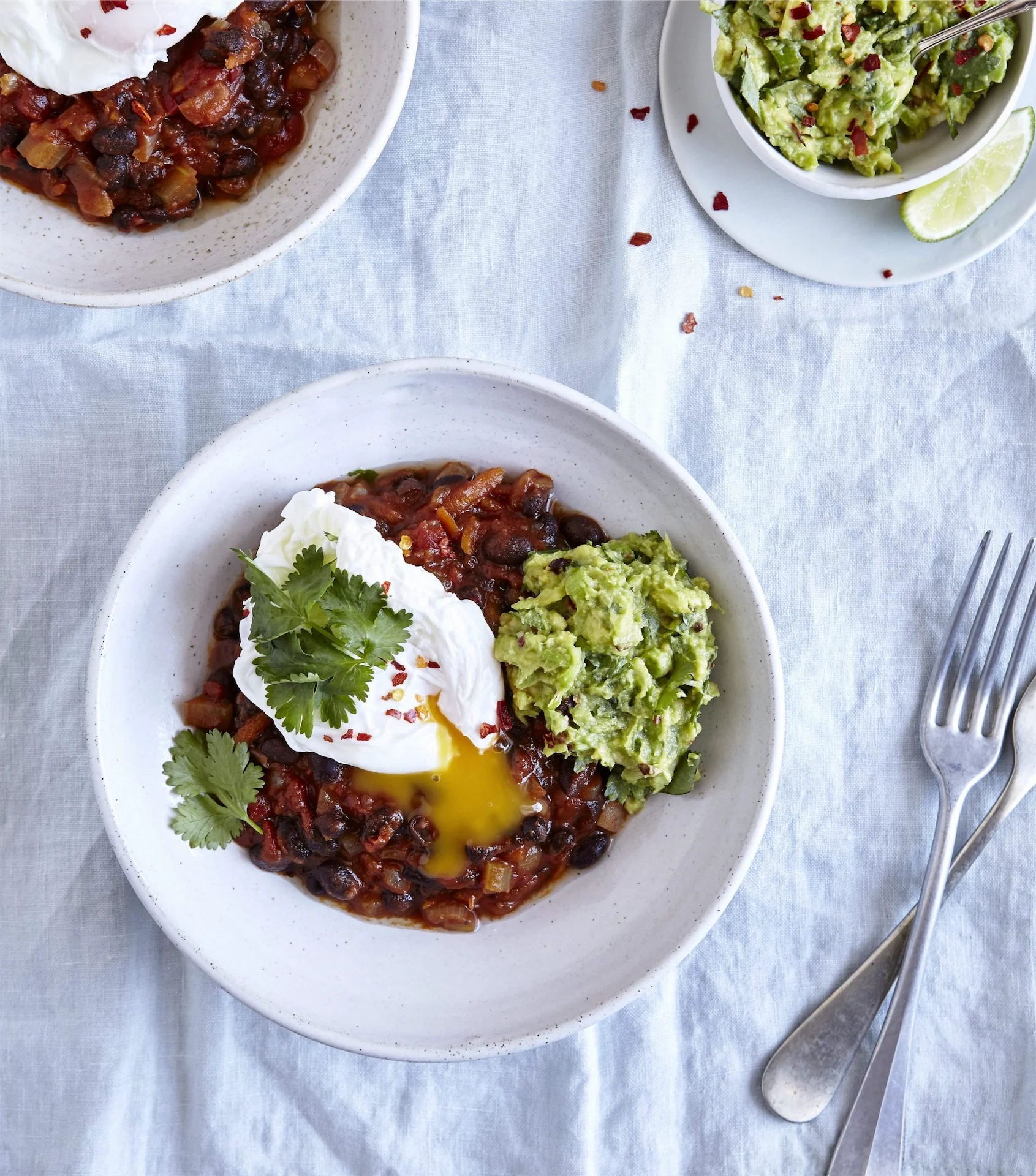 Brunch ideas: Baked black beans, coriander guacamole & poached eggs Brunch ideas: Baked black beans, coriander guacamole & poached eggs