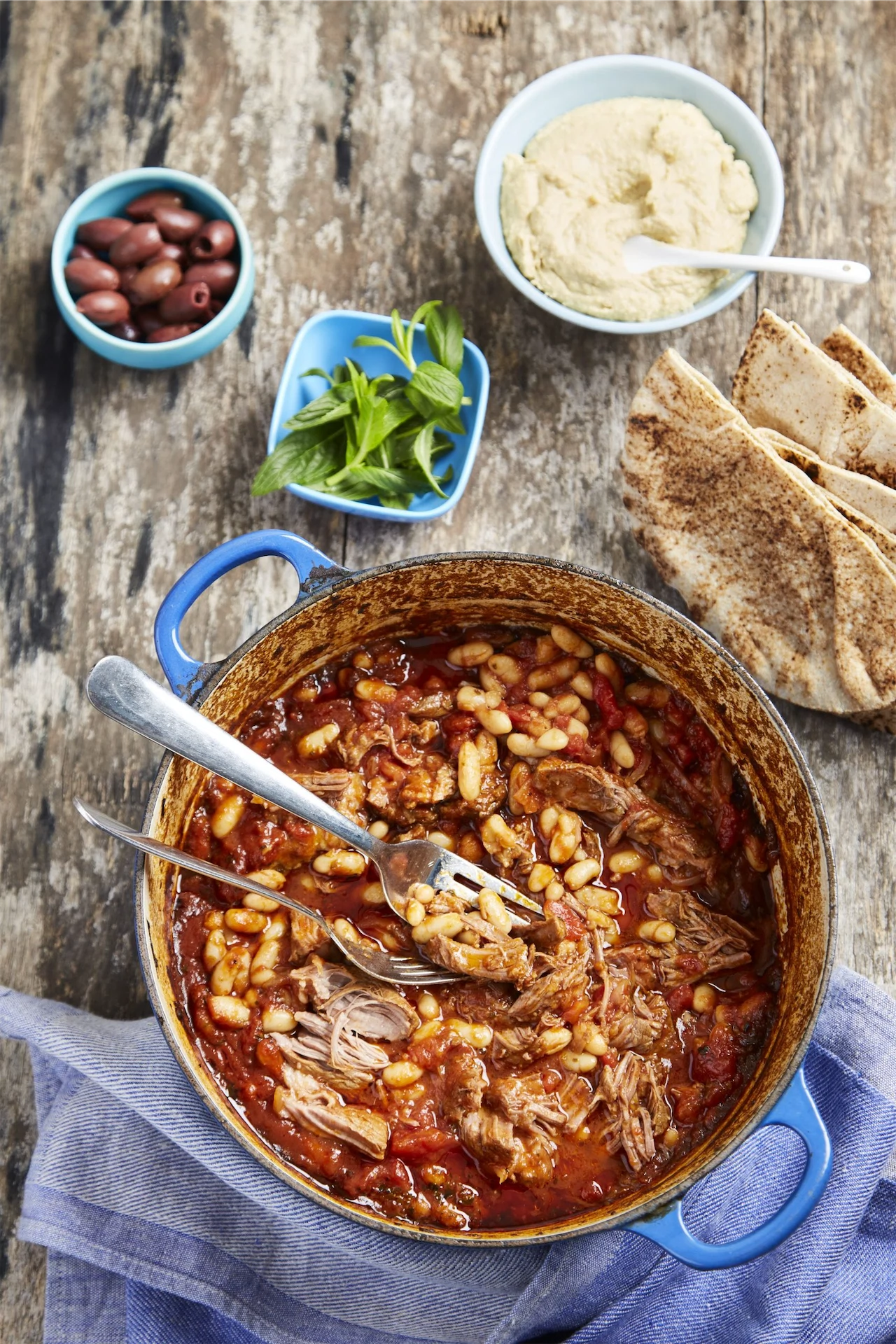 Slow-Cooked Lamb Shoulder With Cannellini Beans & Hummus