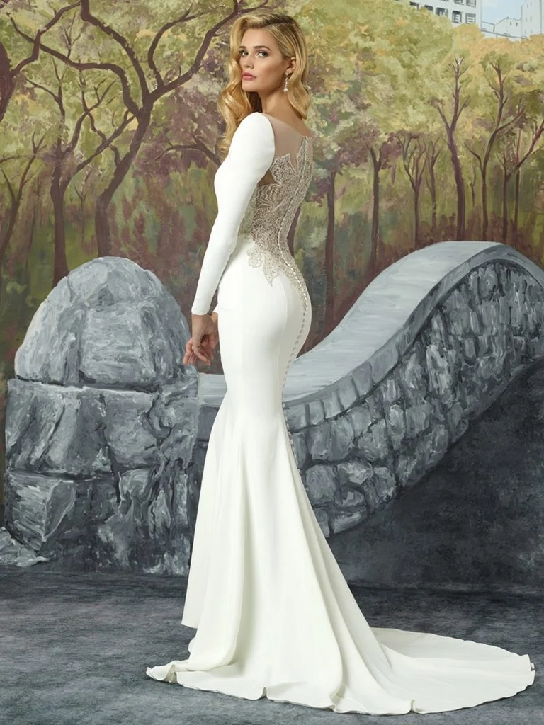 Long-sleeved crepe wedding gown by Justin Alexander, available at mcelhinneysbridalrooms.com