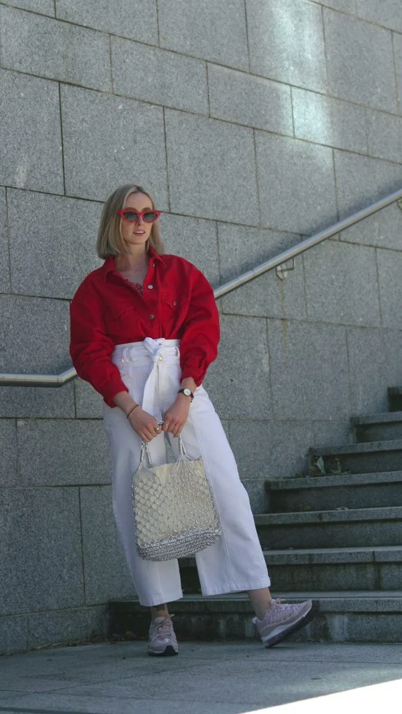 Red cropped denim jacket, €60 at topshop.com, Nike SportswearAir Max 98 in rose, €200 at nakedcph.com, woven shopper bag, €26 at topshop.com