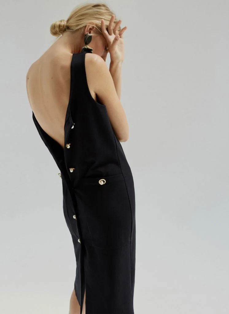 Dress with pearl buttons, €135 at uterque.com