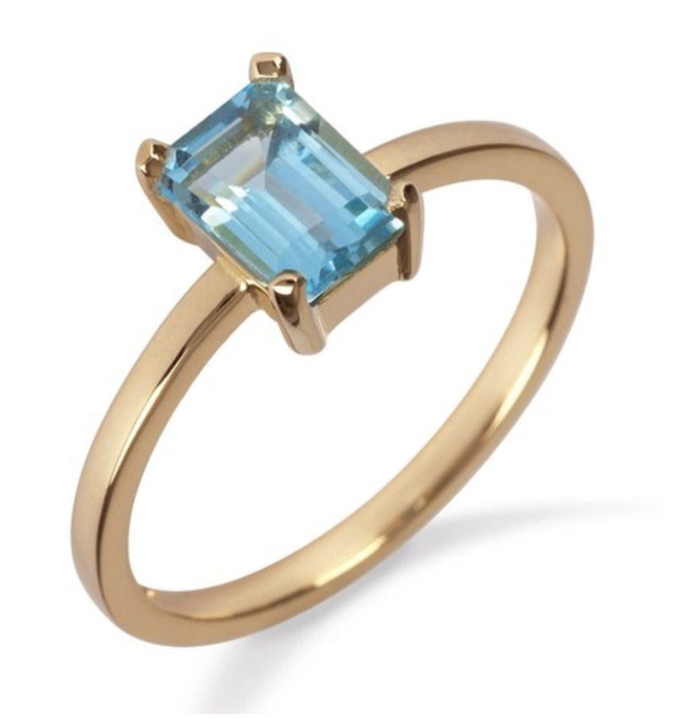 18K yellow gold ring with blue topaz, €695 at momuse.ie