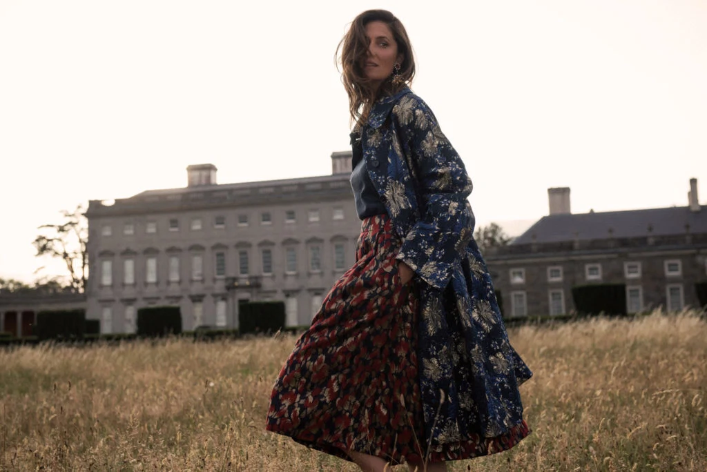 Lurex knit, €59 at stories.com, brocade skirt by Tara Jarmon, €320 at arnotts.ie, brocade coat by Dries Van Noten, €1,495, Star& Bee drop earrings by Thot Gioielli, €24o; both at brownthomas.com