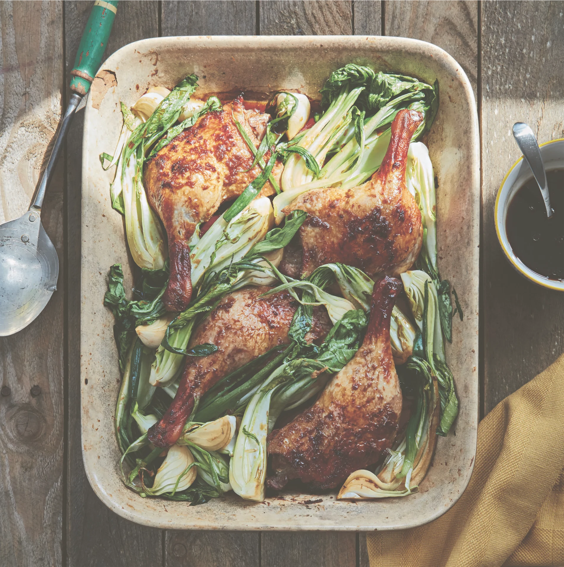 Easy single-tray baked teriyaki duck legs with pak choy
