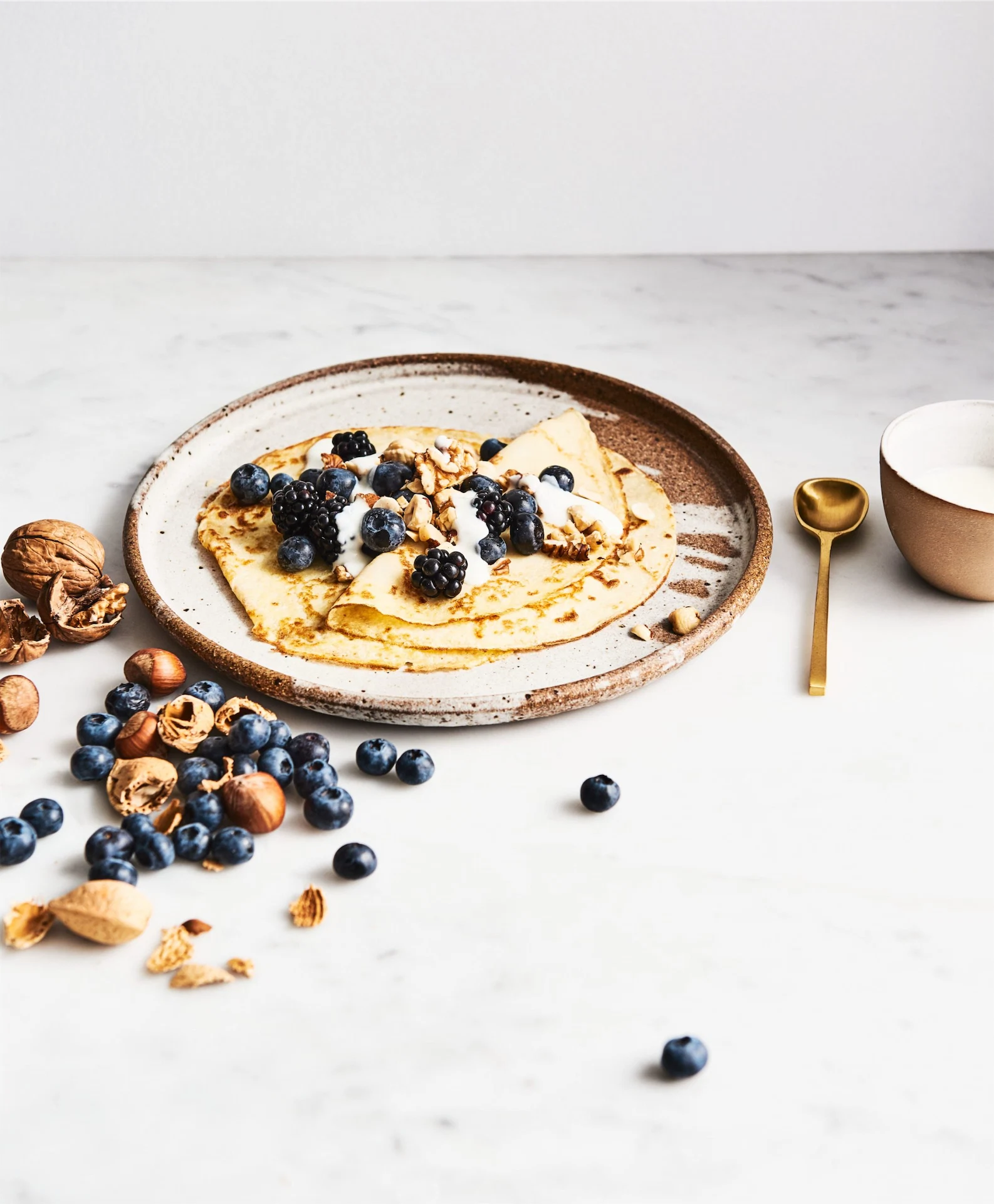 Sunday brunch: coconut crêpes with coconut yoghurt & berries