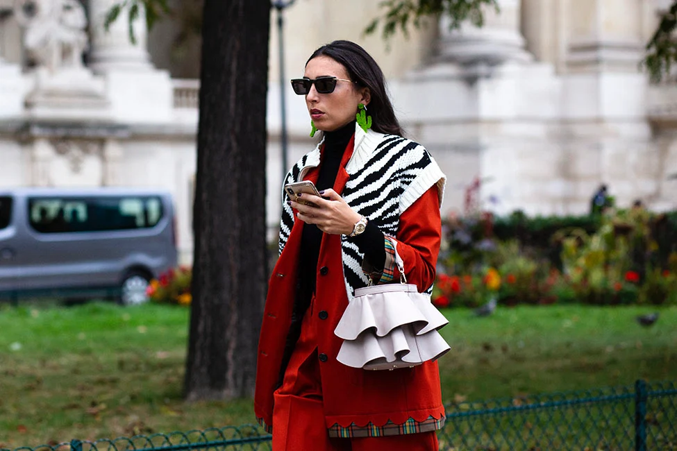 Why are women still so drawn to designer handbags?