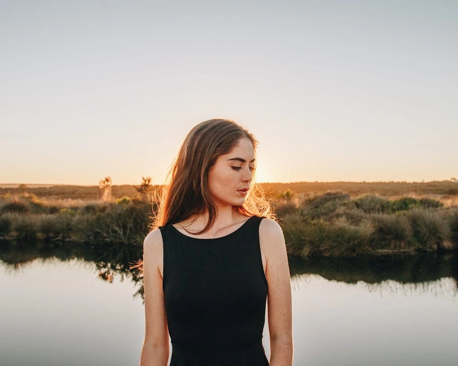 woman looking wistfully into the distance