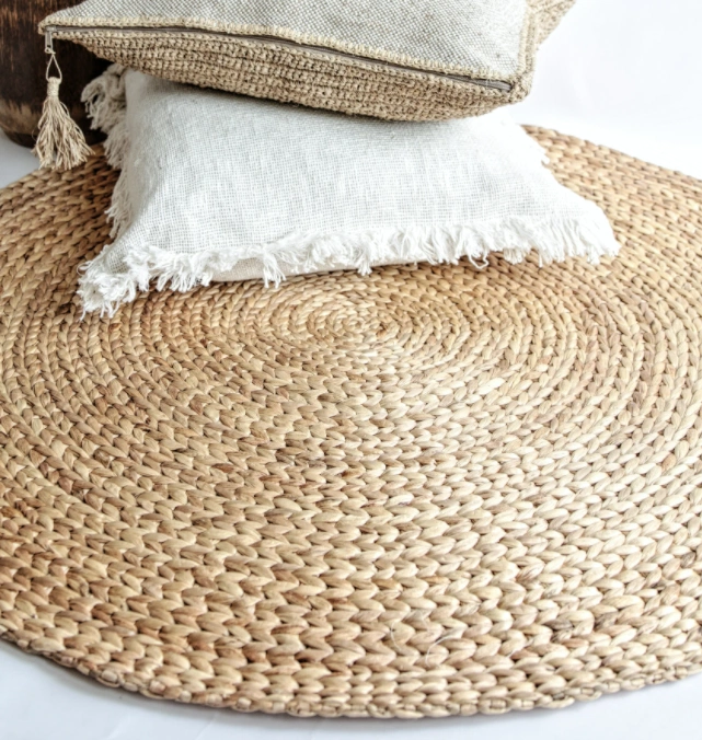 Round woven banana leaf rug, €129, Mano
