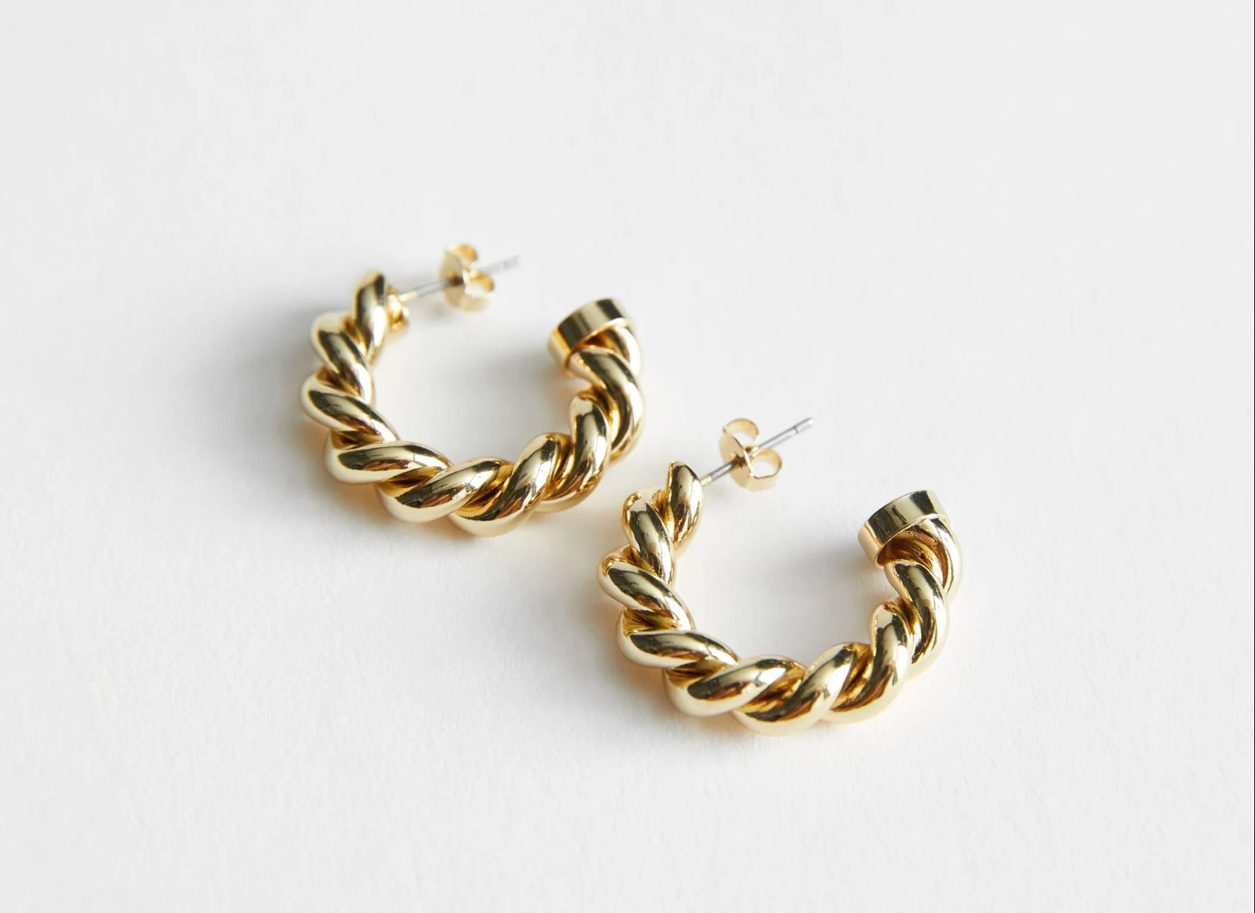 & Other Stories Twisted Hoop Earrings, €19