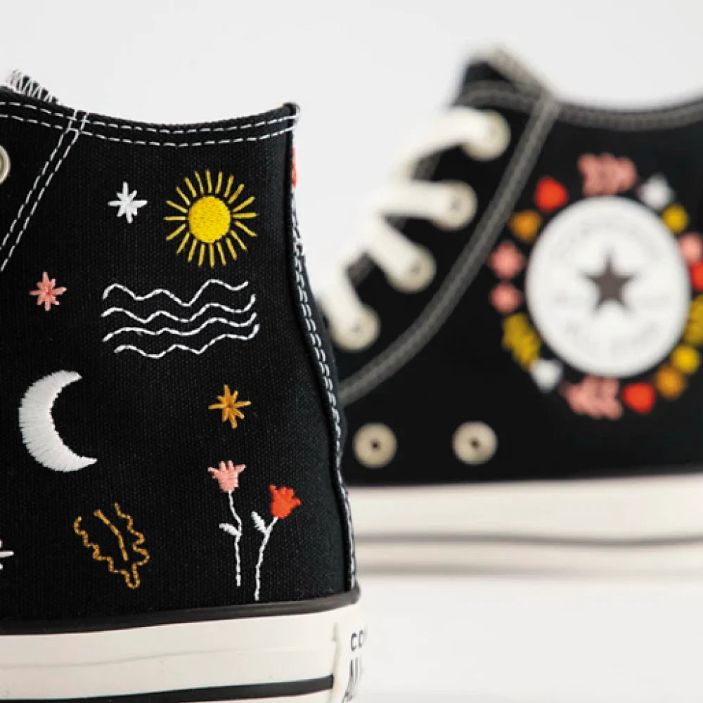 Converse black embroidered trainers, €81