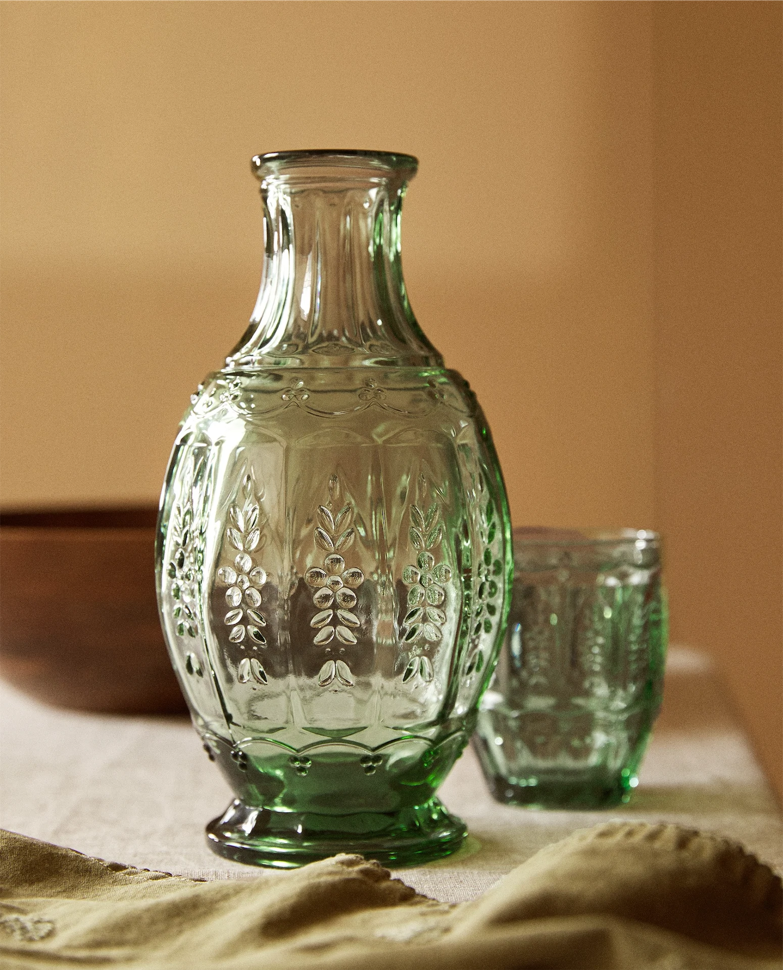 Glass bottle with floral relief, €19.99, Zara Home