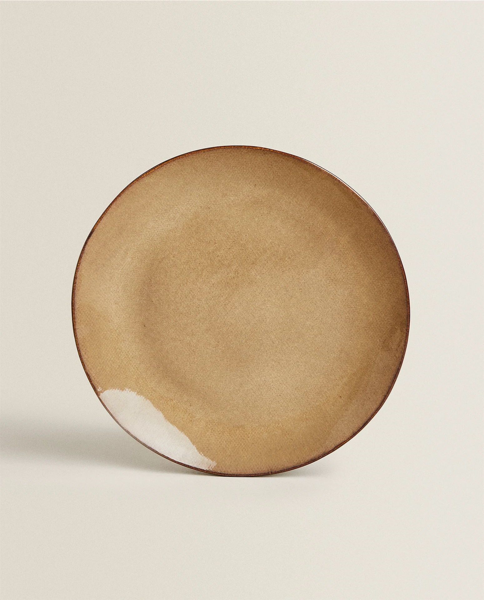 Irregular stoneware dinner plate, €11.99, Zara Home