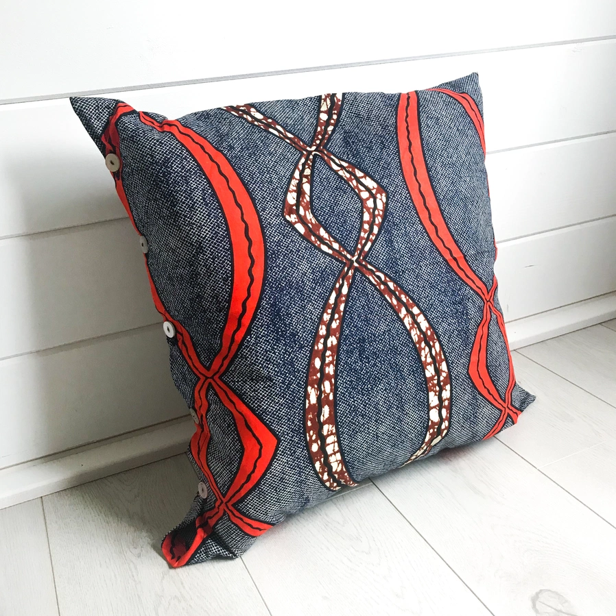 Orange & Navy pattern cushion, €35, Mimi + Martha