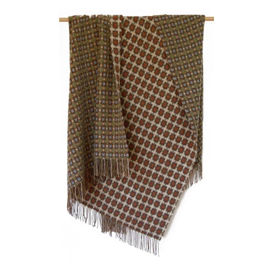 Rollo throw olive, €287, Hedgeroe Home