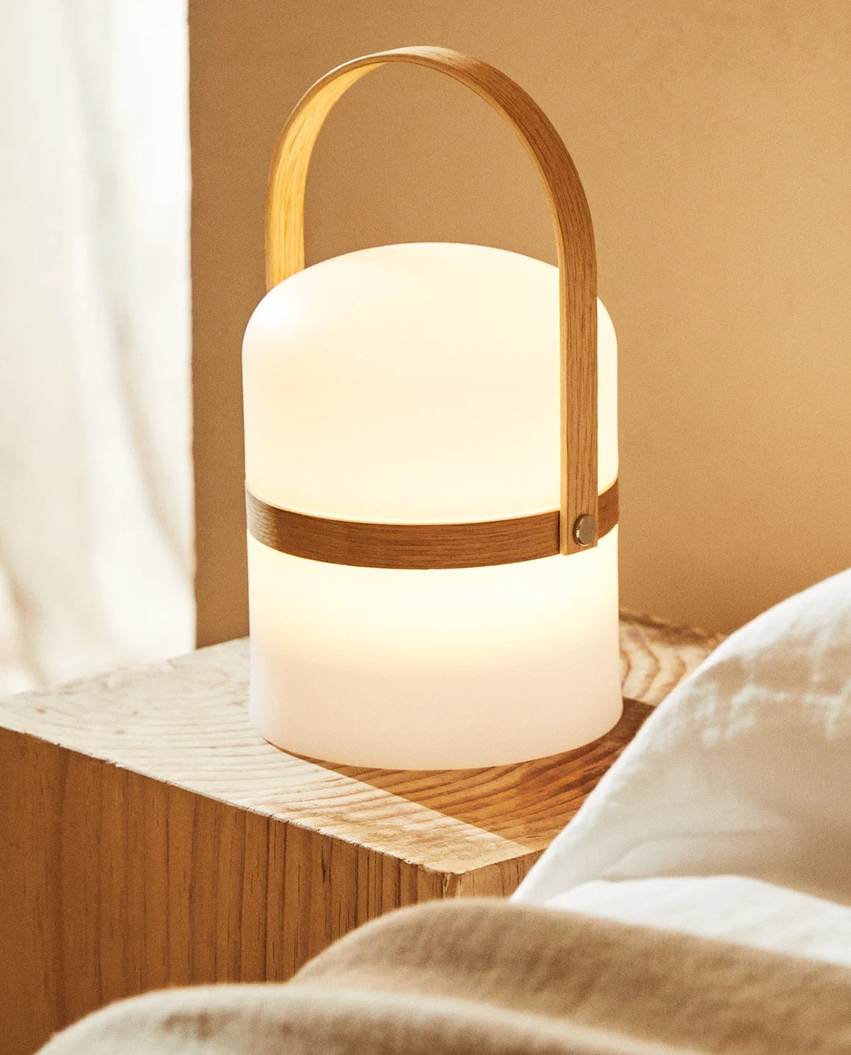 Cordless lamp with handle, €49.99, Zara Home