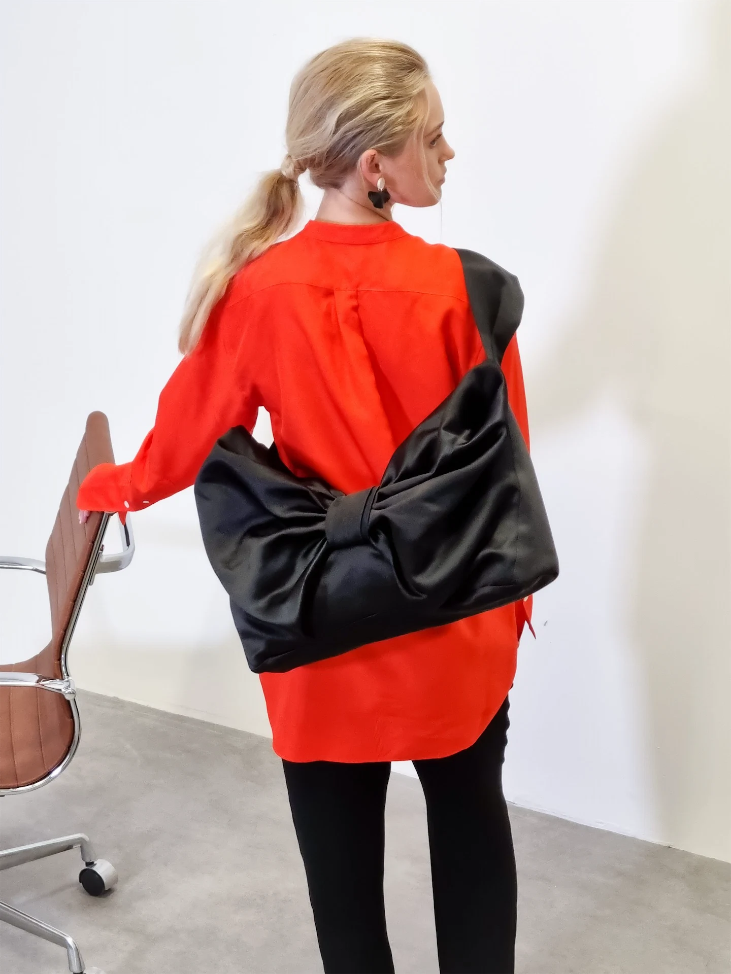 Large crossbody bow in black satin, €295, August Night