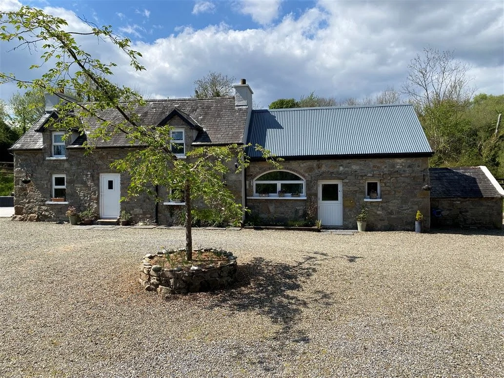 Quaint yet stately: This stone-front cottage in Co Clare is on the market for €280,000 Quaint yet stately: This stone-front cottage in Co Clare is on the market for €280,000