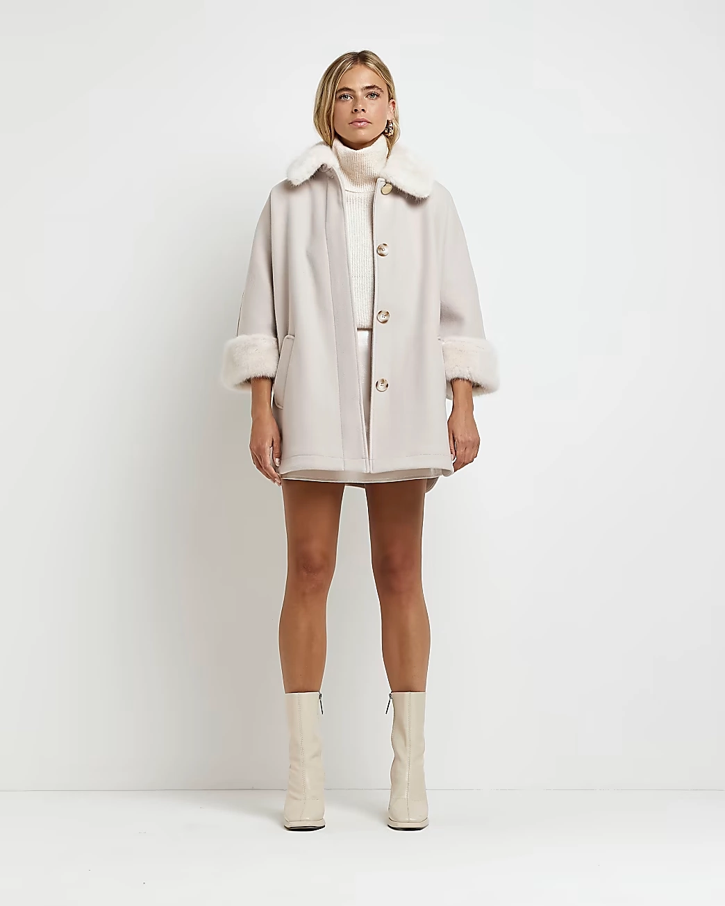 Cream Faux Fur Trim Cape Coat, €115, River Island