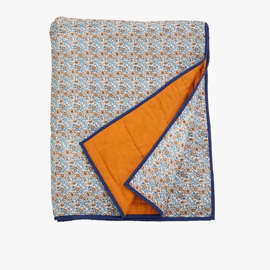 Floral throw, €59.99, Stone + Beige