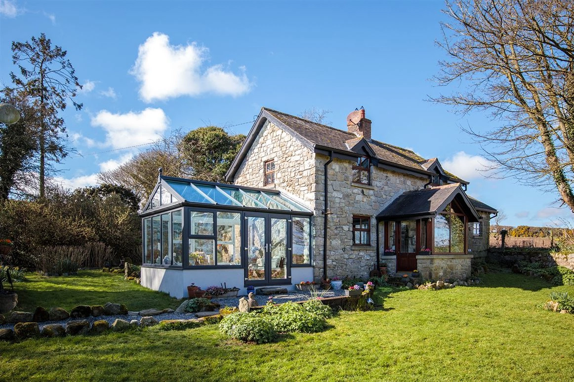 This homely stone cottage with idyllic country views is on the market for €295,000 This homely stone cottage with idyllic country views is on the market for €295,000