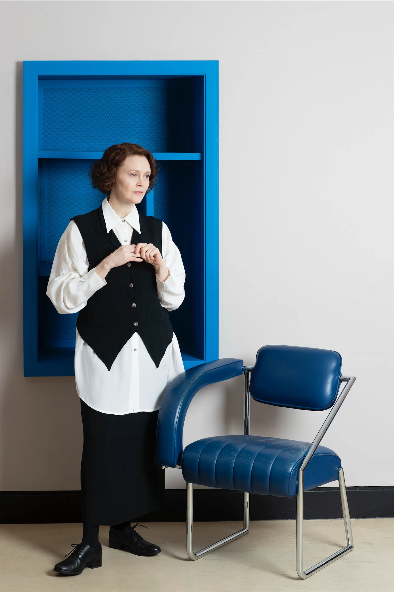 Eileen Gray portrayed by actress Simone Kirby, dressed by Mariad Whisker. Shot at the National Museum of Ireland Decorative Arts & History, Collins Barracks, where some of Eileen Gray’s original pieces are kept.