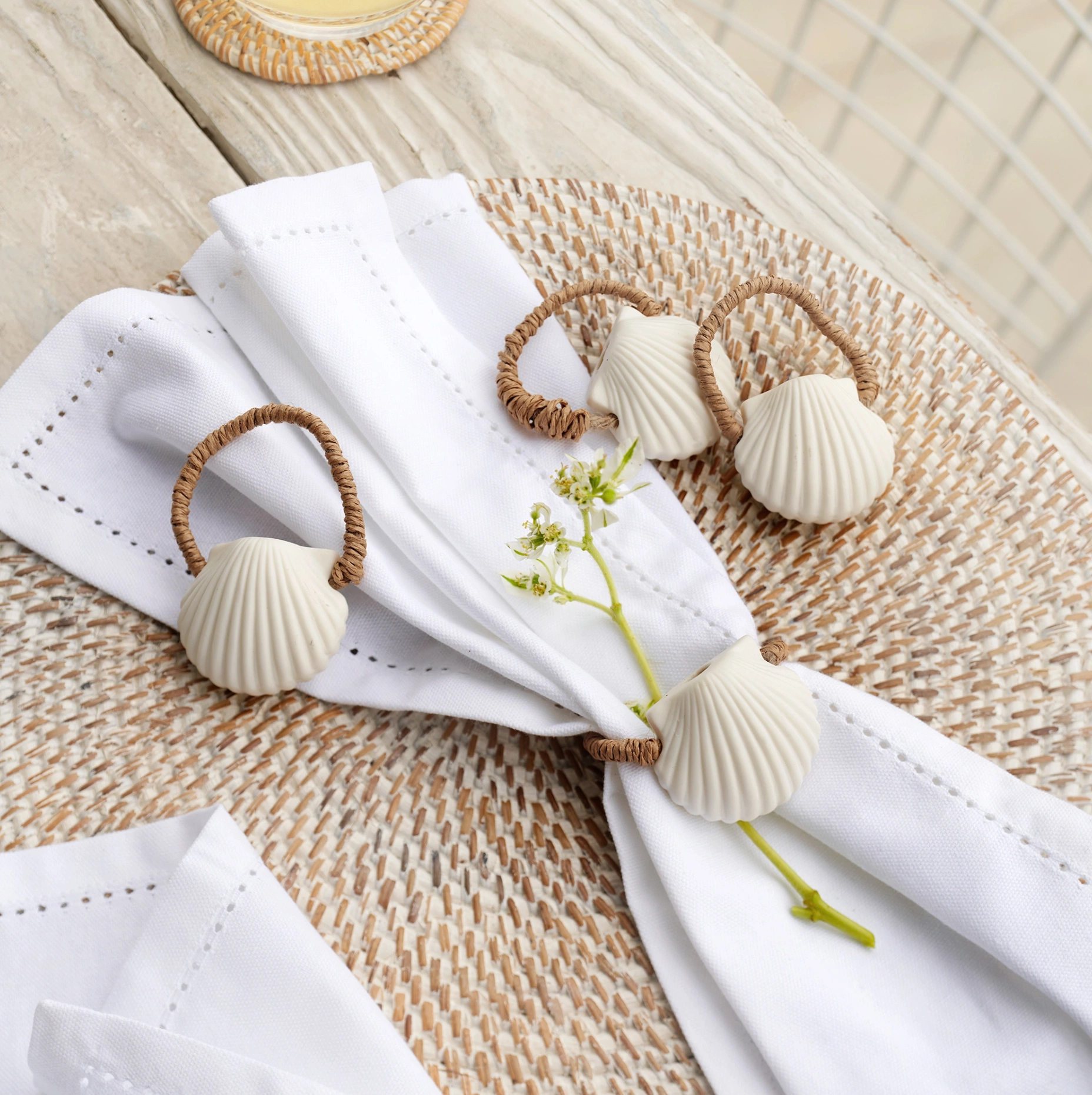 Ceramic Shell Napkin Rings set of 4, €33, The White Company