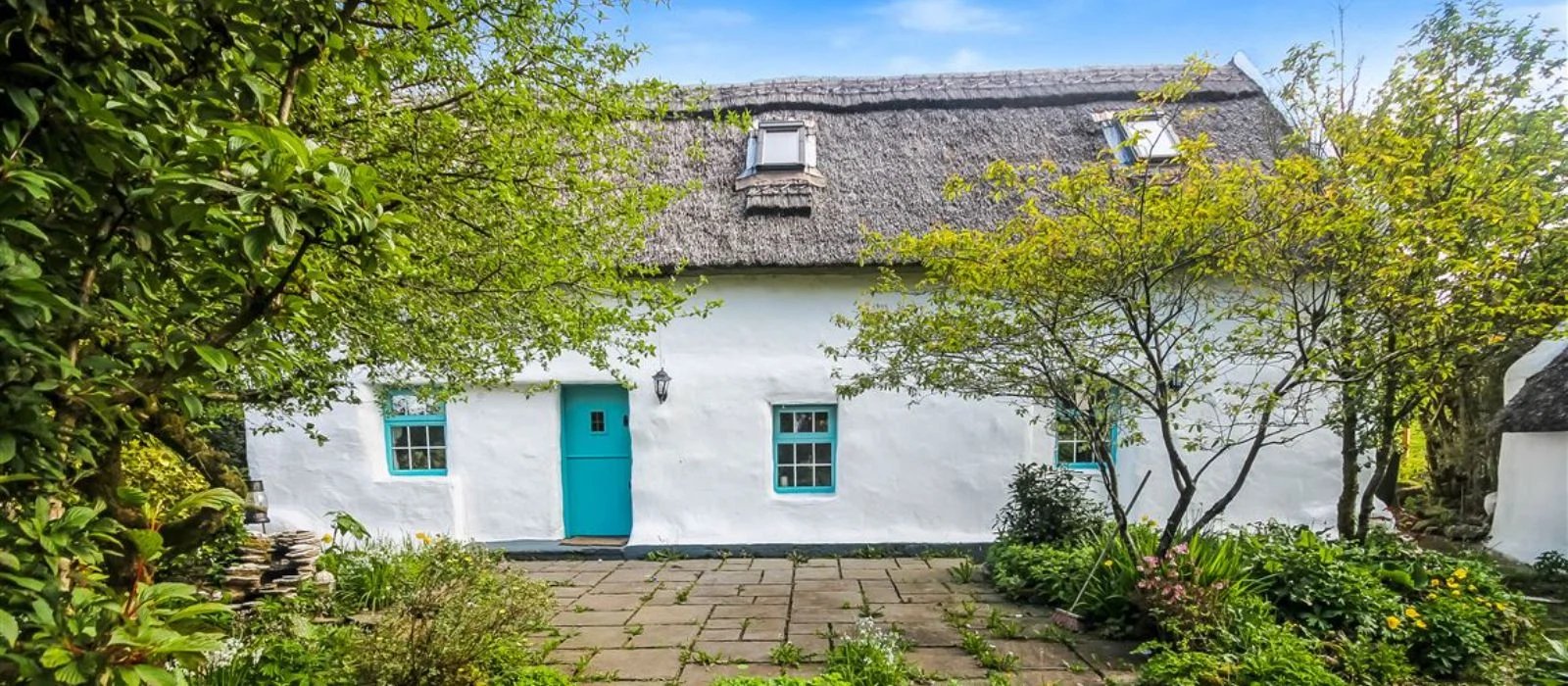 Nestled in the foothills Wicklow Mountains, this traditional thatched cottage is on the market for €380,000