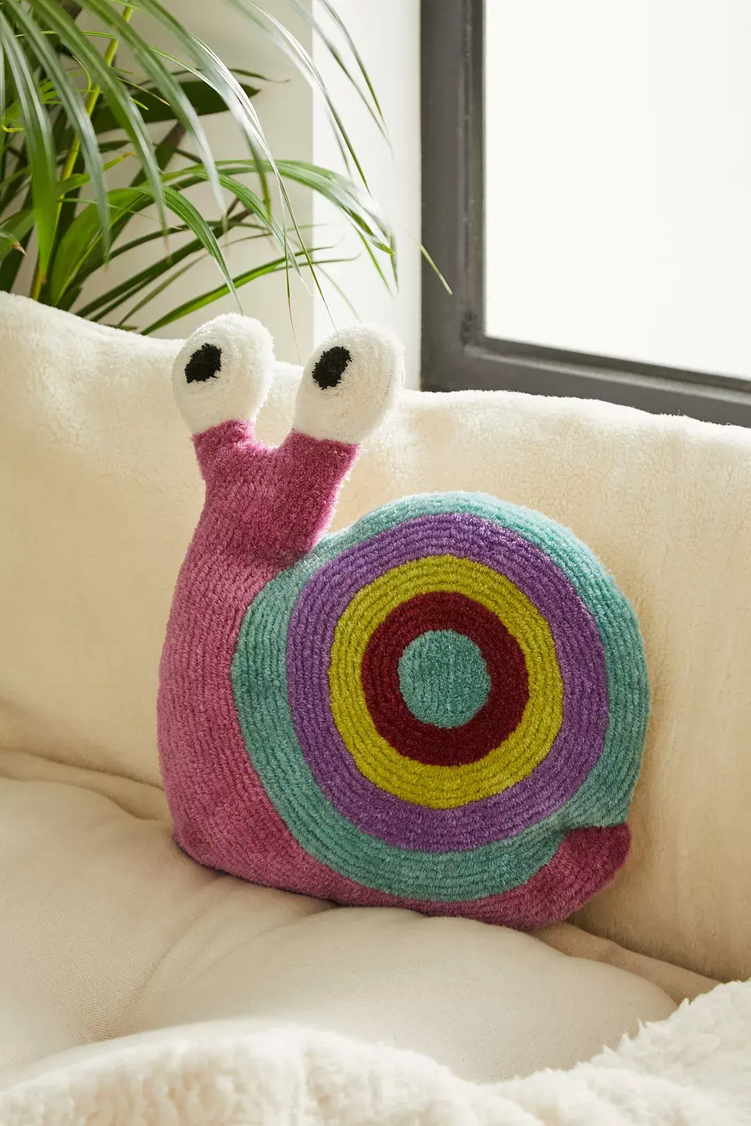 Urban Outfitters, Snail Tufted Cushion, €35