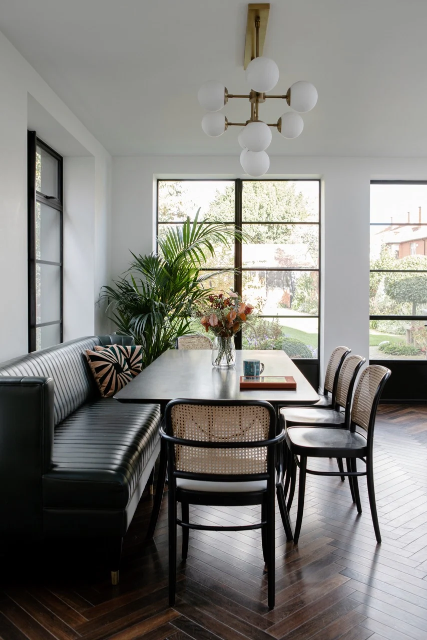 Custom-made banquette in Whistler leather, table and rattan chairs by GTV Design 