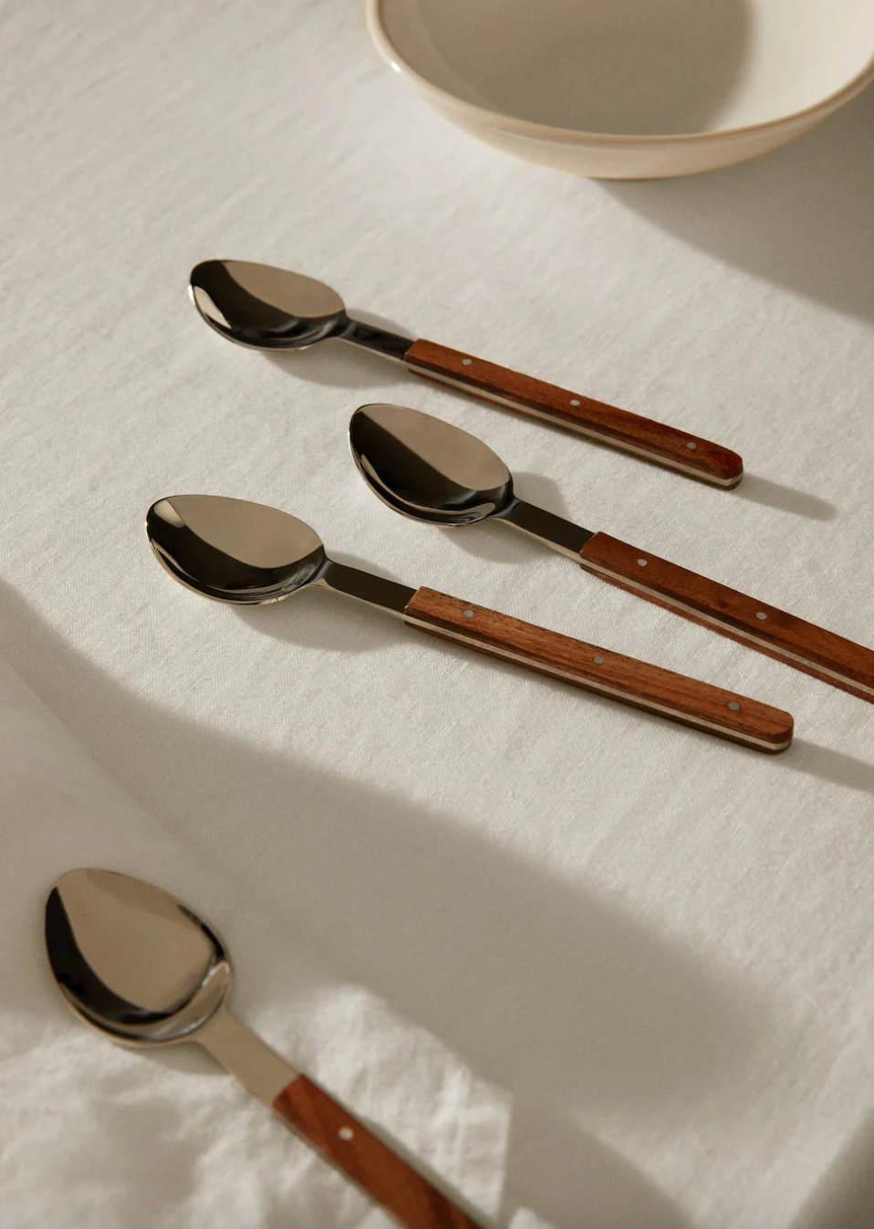 Pack of 4 wooden-handle spoons, €22.99