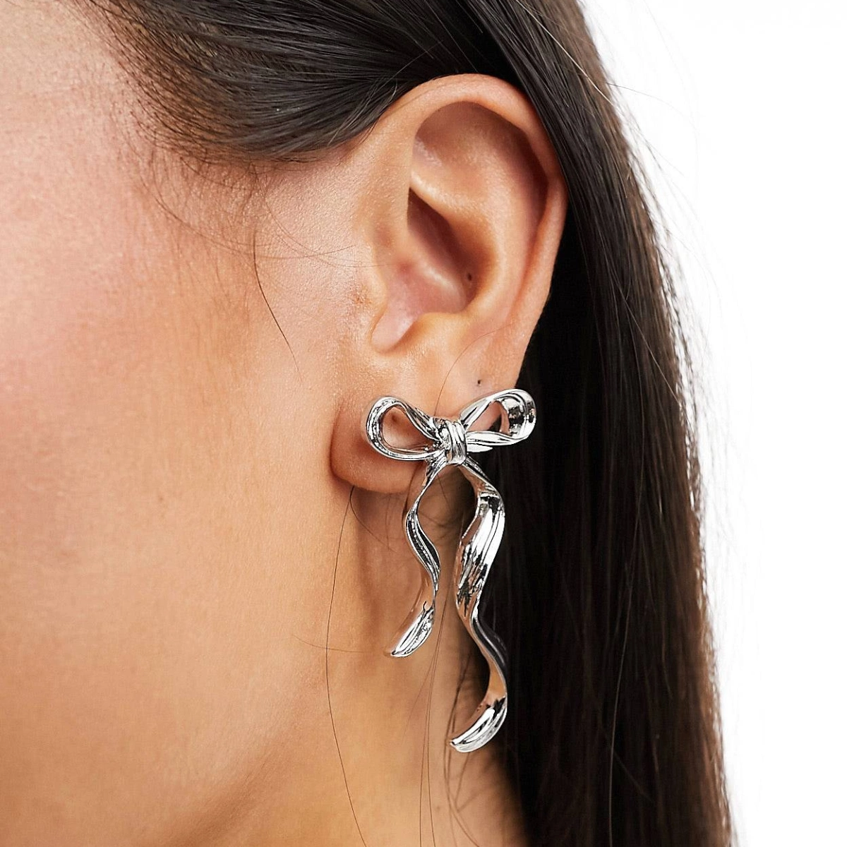 ASOS DESIGN Stud Earrings with Bow Design, €9.99, ASOS