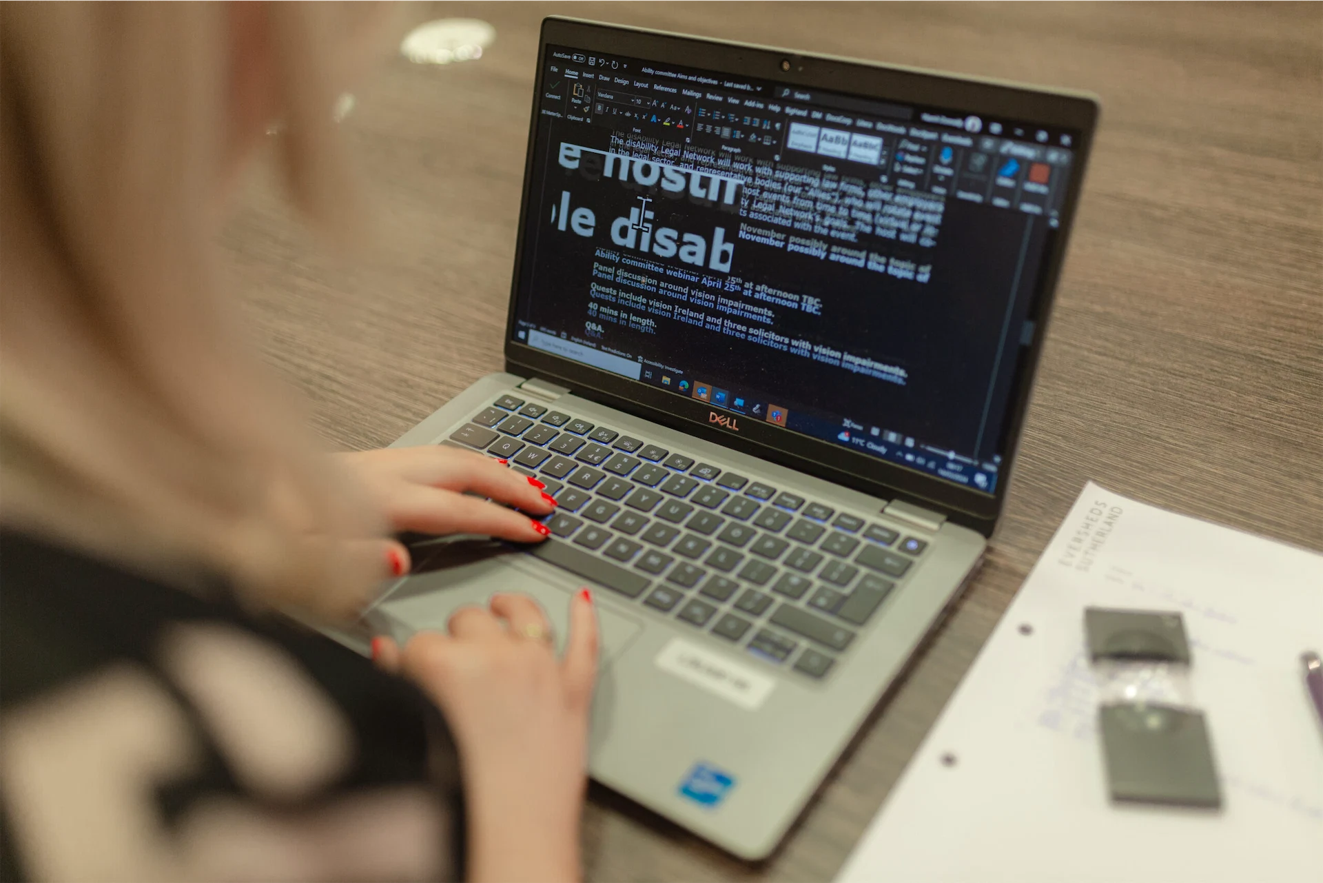 Niamh Donnelly uses a magnifier tool to read her laptop screen.