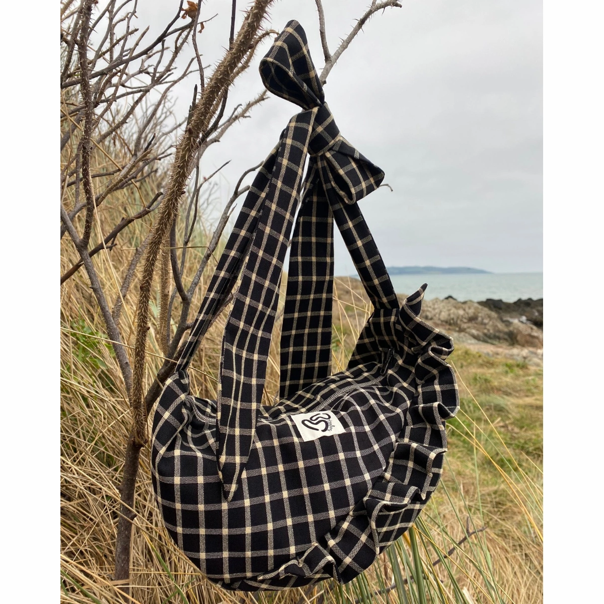 Bogha Black Check Pouch, €90