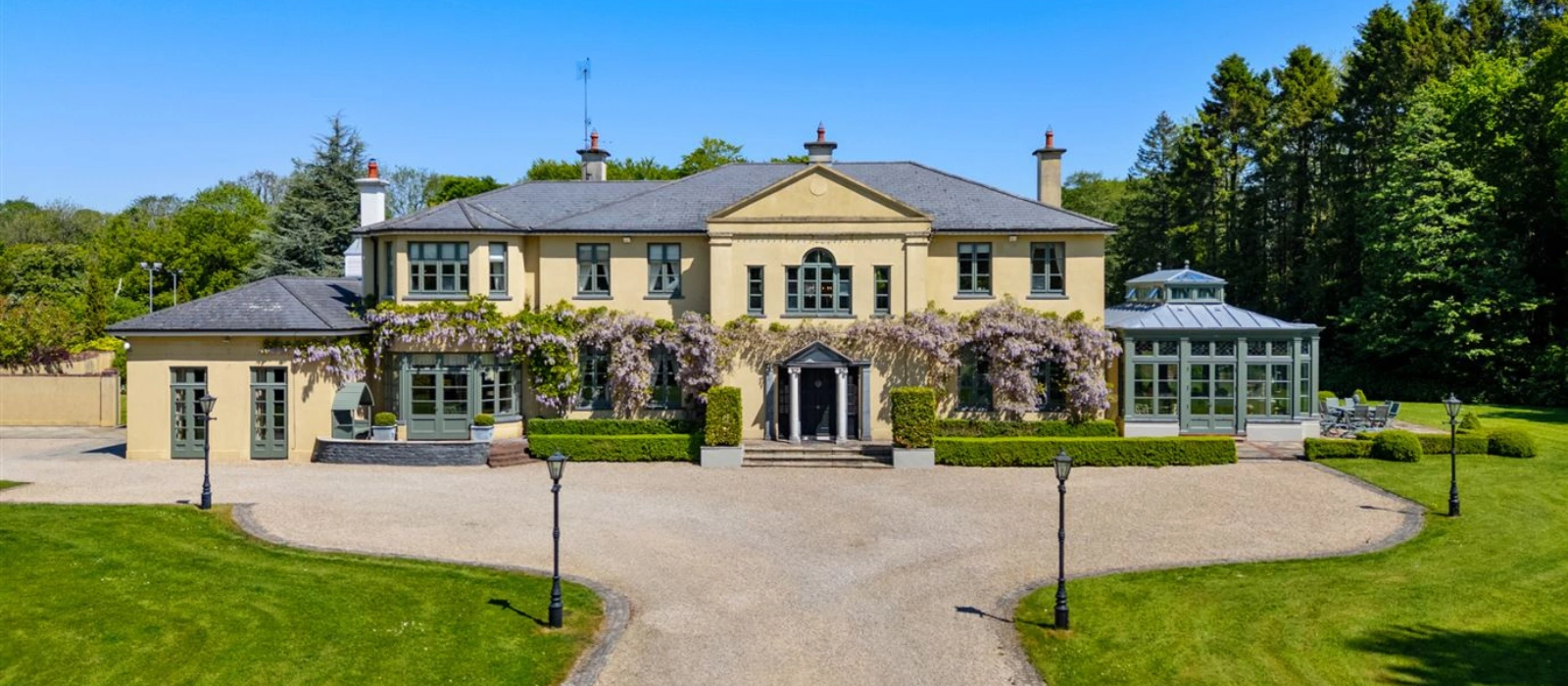 This Naas property has its own tennis court, stables and charming gate lodge