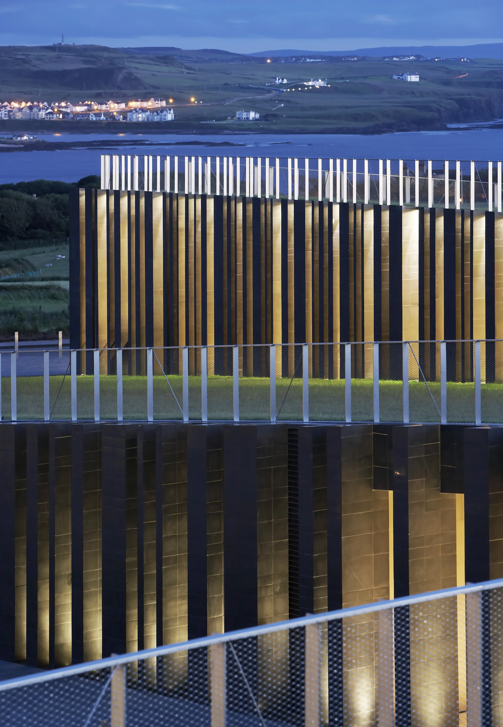 The Giant’s Causeway Visitor Centre echoes the basalt columns that sit beyond it, shot by Hufton + Crow